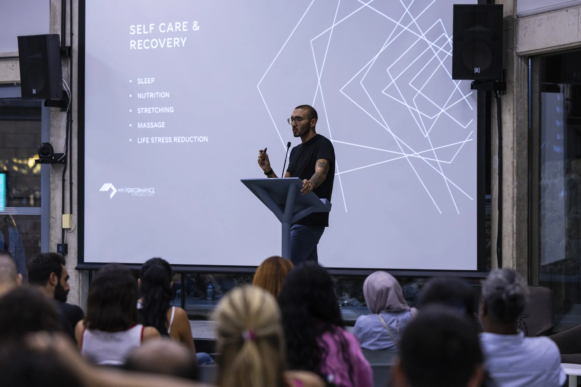 Karim presenting at a performance talk